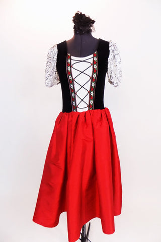 Character style ballet dress has black velvet lace-up bodice with embroidered ribbon trim accent, white/silver sequined pouf sleeves & a long red taffeta skirt. Front