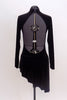 One piece black velvet leotard has long sleeves, high neck and open back. Has an attached angle skirt. Simple but pretty. Back