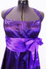 Purple halter  A-line knee length dress has black lace overlay & purple satin piping on petticoat. Has wide pleated  waistband with large satin bow under bust. Front Zoom