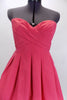 BCGB coral mini taffeta party dress has boned corset style bust area crossover front pleating accent. Has hidden side pockets & no-slip strip along top edge. Front zoom