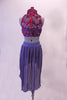 Periwinkle finely pleated chiffon, knee-length high-low skirt has a wide waistband. The high neck half-top has a periwinkle base with a purple sheer that is adorned with sild roses in shades of pinks, purples and deep berry. Comes with deep berry coloured floral hair accessory. Back
