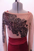 Printed nude mesh full unitard has a black lace pattern in the fabric that cascades at an angle across the torso both front and back. The pattern continues along the long sleeves & legs accented with many scattered crystals. High waisted maroon shorts sit over the unitard and a maroon bra beneath. Front zoomed