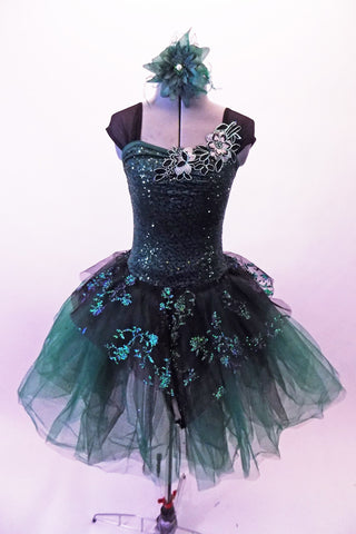 Dark green romantic tutu has a floral lace appliqued, peak style-overlay that compliment the silver green floral lace appliques at the upper bustline. The tulle skirt is deep forest & emerald green with matching dark green wide shoulder straps & sweetheart style sequined emerald green bodice. Comes with a hair flower. Front