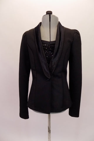 Thicker stretch blazer coat with princess seams and satin lapels, shoulder pads and jewelled button closure. It is accompanied by a sequined black haft top that sits beneath the blazer. Can be worn with either pants or shorts. Front