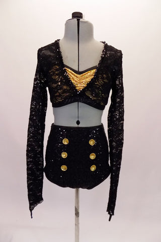 This 2-piece costume has a long-sleeved black lace half top with deep V front and an open back. The lace top sits overtop of a gold sequined bra with pinched front. The high-waisted fully sequined, black, brief style bottom has six gold sequined applique buttons along the left and right hip. Front