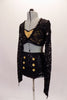 This 2-piece costume has a long-sleeved black lace half top with deep V front and an open back. The lace top sits overtop of a gold sequined bra with pinched front. The high-waisted fully sequined, black, brief style bottom has six gold sequined applique buttons along the left and right hip. Side