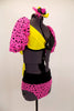 Two piece costume has bright pink pouf sleeves with black spots attached to a yellow and black twist front bra with large yellow back bow & matching pink bottom. Comes with hair accessory. Right side