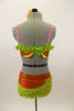 Two-piece costume has red and orange tartan bra with green lace ruffle trim, appliques & red crystals. Orange short has green lace ruffles & matching applique.Has matching hair accessory. Back