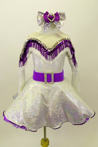 Silver dress has long sleeves and nude mesh upper. The bust-line is decorated with silver sequined, purple and white fringe. The dress has a wide purple belt with matching purple petticoat. Costume comes with silver and purple hair accessory. Front