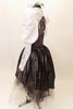Charcoal leotard with open sides & back, has high collar, lace shrug with pleated satin pouf sleeves. Skirt is iridescent black high-low overlay on black & grey tulle. Comes with large white hair accessory. Left side