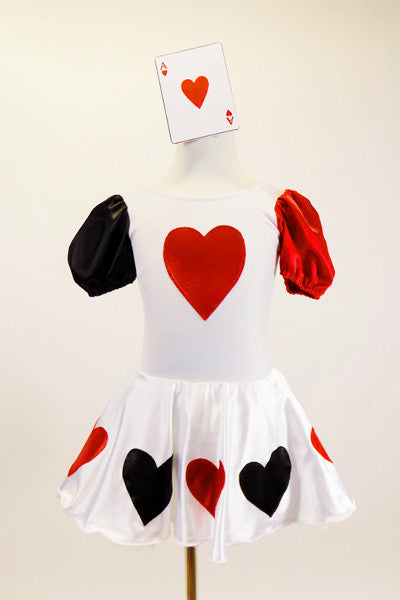 White velvet leotard dress has heart motif on bodice.White satin skirt has alternating red & black hearts over white petticoat. Has ace of hearts hair piece. Front