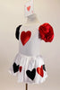 White velvet leotard dress has heart motif on bodice.White satin skirt has alternating red & black hearts over white petticoat. Has ace of hearts hair piece. Left side