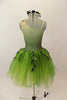 Forest themed green romantic tutu dress has single shoulder with ribbon branches & 3-D leaves.Tutu is layers of soft green fading tulle. Has leaf hair accessory. Back