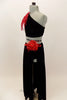 Black velvet 2-piece costume has one long sleeve & shoulder half top with large red floral leaf accessory at  shoulder. The long skirt has full length slit. Comes with red floral hair accessory. Left side