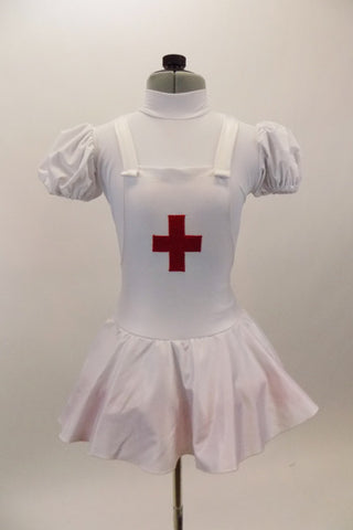 White pouf sleeved nurse’s dress had red petticoat & attached pinafore with large red cross on the front. Comes with matching nurse hat. Front
