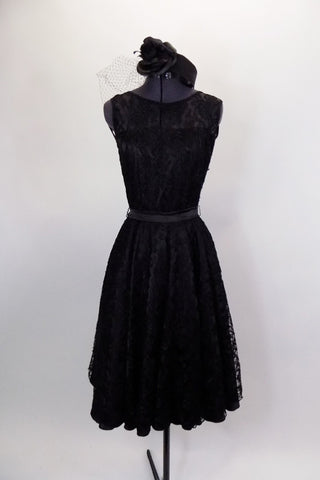 Black lace vintage dress had lace upper and open V-back. It is lined and has a full tulle petticoat & satin belt. Comes with matching veiled pill hat. Front