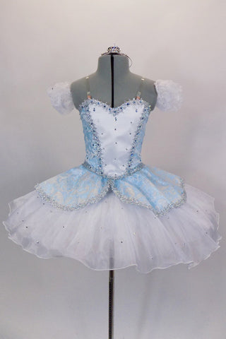 Blue leotard base has separate blue damask bodice with front insert & silver braiding. Tutu overlay is crystal covered white organza with matching blue damask. Comes with crystal tiara. Front.