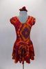 Tie-Dye style flowy tank dress with cap sleeves has scoop neck front and back in shades of reds browns & oranges create the 60s vibe. Comes with hair accessory. Back