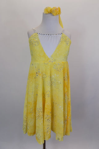 Yellow mesh lyrical dress with silver swirl designs has low deep V front with white crystaled center & crystaled straps. Comes with matching hair accessory. Front