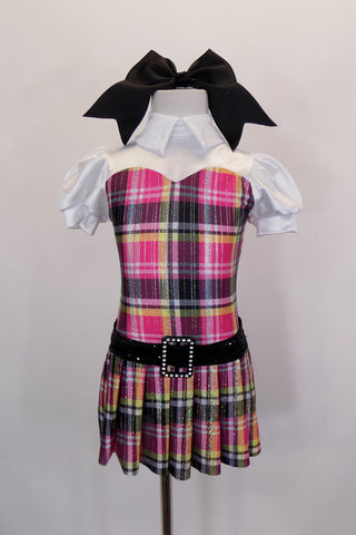 School girl themed pink & black tartan dress with rhinestone accent belt has upper chest that has white with pouf sleeves, white shirt collar & keyhole back. Comes with large black hair bow. Front