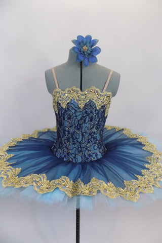 Deep blue tulle sits on light blue tulle layer & white pancake tutu base. Bodice is deep blue & gold lace lined with pale blue spandex. Has wide gold lace trim.. Front