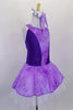 Lavender tutu dress has purple floral print skirt, front center & shoulders, with dark purple sides & back. There is a pleated white 3-layer tutu below skirt. Comes with matching hair accessory. Side