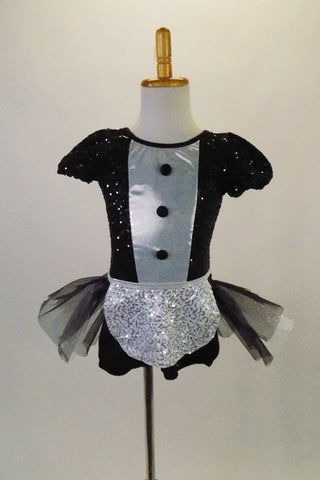 Cute French waitress inspired costume is a black sequined short unitard with pouffe sleeves & shiny white front accented with black buttons. The bustle skirt of crisp black & white pleated tulle gives the costume a sweet accent & is complemented by a small white sequined apron. Comes with adjustable chef hat & gloves. Front