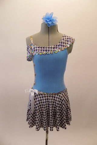 Pale blue based single shoulder costume has houndstooth ruffle and short flounce skirt accented with silver sparkle sequin. The bow accent at hip and sequined buttons along the right side give the costume and vintage flair.  Comes with matching hair accessory. Front