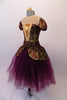 Stunning baroque style ballet dress is a burgundy base with gold brocade print & sheer nude illusion neckline above inlay pop. The matching pull-on peplum overlay with a wide waistband sits over top of a burgundy tulle romantic tutu skirt. The low scoop back and separate pull-on pouffe sleeves finish the look. Side