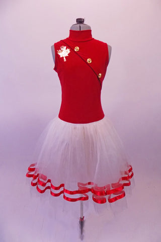 Romantic ballet tutu has a large golden maple leaf on the right bust of the bright red bodice. Large gold buttons line the front in a military angle while the back is a large open keyhole. The layered white skirt has red ribbon edging. Comes with gold maple leaf hair accessory. Front
