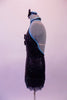 Jazz costume is a black fully sequined dress with pale blue piping. The attached hip skirt is a fully beaded black & blue fringe. The torso has a peek-a-boo hole with two small bow accents that keep it closed. The large open back has a nude horizontal strap to keep the front in place. Comes with a black sequined bow. Left side