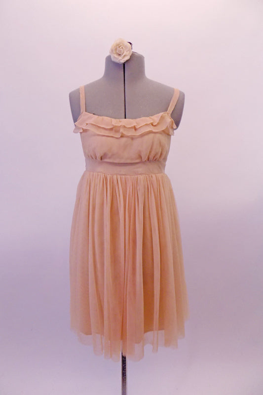 Nude-ivory soft mesh Empire-waist dress has a delicate double ruffle along the scoop bustline. The dress has and a smocked back and thicker straps. The front waistband turns into delicate straps that tie into a bow at the back. Comes with a hair accessory. (dancer needs to provide own brief/short). Front