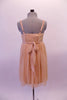 Nude-ivory soft mesh Empire-waist dress has a delicate double ruffle along the scoop bustline. The dress has and a smocked back and thicker straps. The front waistband turns into delicate straps that tie into a bow at the back. Comes with a hair accessory. (dancer needs to provide own brief/short). Back