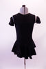 Black leotard dress has a short flowy peplum skirt that attaches in a low front/back princess cut waistline. The back is an open keyhole. Comes with ruffled armband accessory. Front