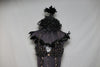 Black bra attached to skirt by lace appliqués. The bra is extensively covered with  large AB Swarovski. Has an attached panty. Front zoom