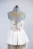 White rose fabric bodice is heavily embossed with large silver appliqués and crystals attached to white high-low skirt with pewter grey long bow at back. Front Zoom