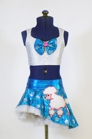 Turquoise sparkle skirt with silver polk-a-dots, white petticoat skirt & pink poodle.Separate pink panty and white half-top with matching turquoise bow accent. Front