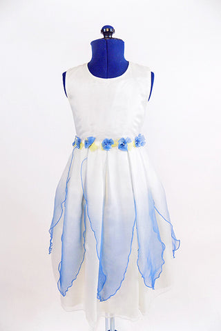 White organza dress with sheer blue overlay and blue flowers around waist. Front