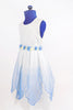 White organza dress with sheer blue overlay and blue flowers around waist. Side