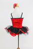 Red sequin leotard  has center panel of black ruffles. Comes with black  tulle skirt with red satin edge, black gauntlets & red satin floral hair accessory. Back