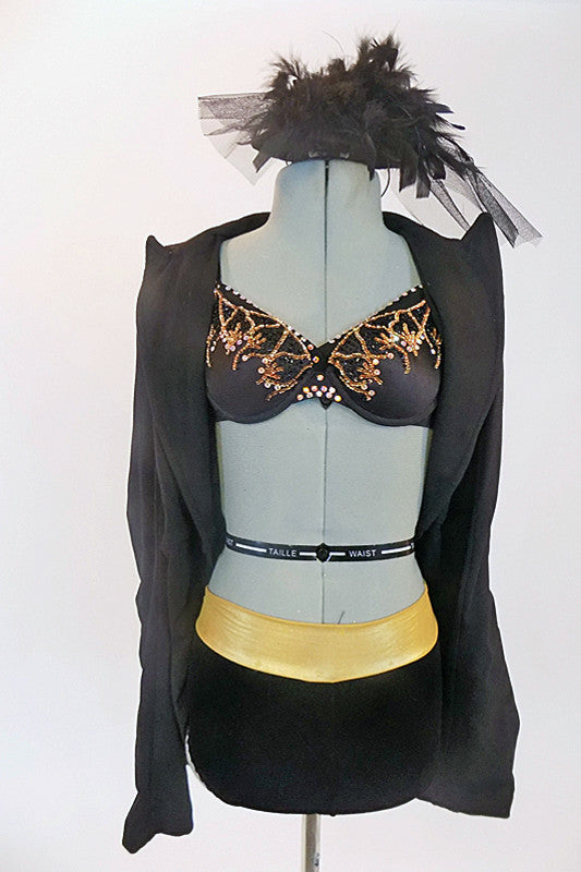 Black Marciano bra with gold sequin detail in accompanied by black & gold shorts and a fitted stretch blazer. Has matching vintage hair accessory. Front