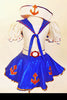 Sailor themed costume has white half top with blue collar, red  anchor motif & red crystals. Come with a blue skirt with white petticoat & white sailor hat . Front zoom