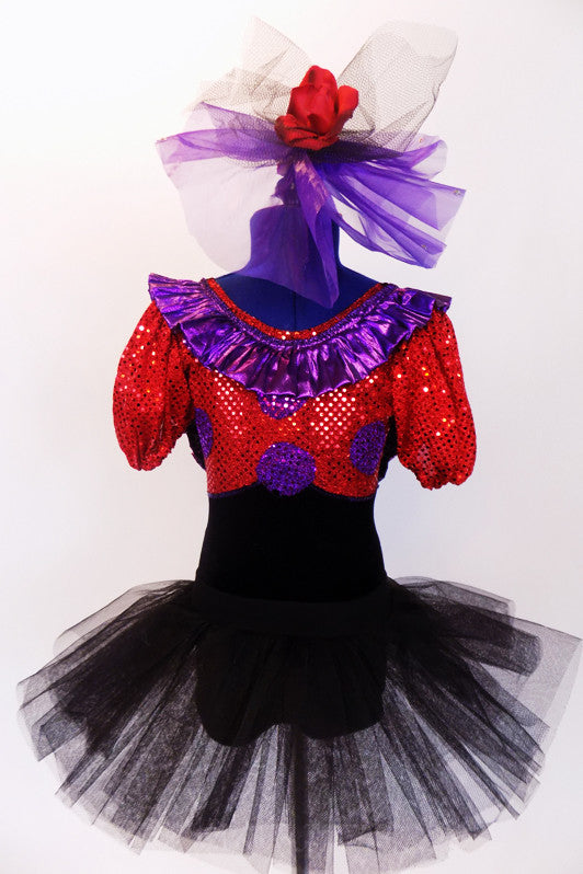 Black velvet &,red sequin leotard with purple circles and pouf sleeves. Purple ruffle around the collar & low back.Has black tutu skirt & hair accessory. Front zoom