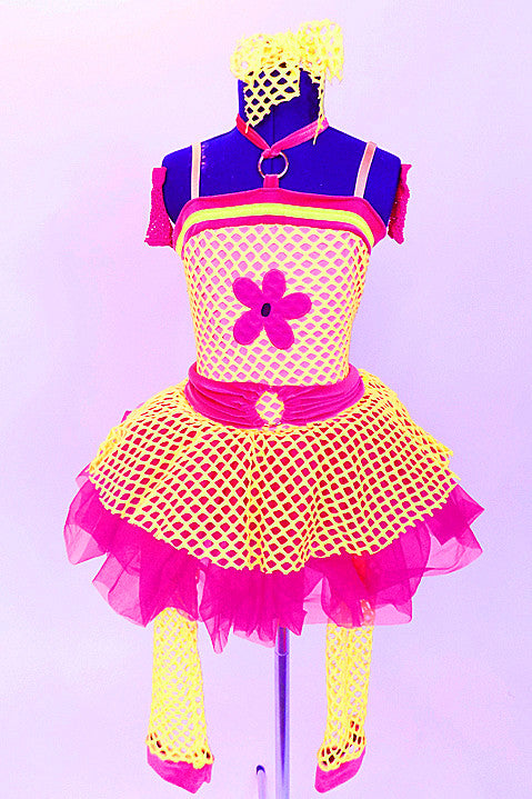 Yellow stretch net dress over bright pink skirt with a large  flower applique on the front of the bodice. Comes with  gauntlets, mesh leg warmers, and hair bow. Front