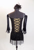 Black merry-widow style mesh dress has lace up corset front with green lace accent. Costume is covered with  crystals & has long black gloves & head piece. Back