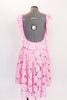 Pink leotard dress has pink sequined, floral lace overlay & high-low skirt . The scoop neck and low  back are has pink crepe ruffle.& matching hair accessory. Back