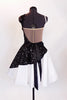 White dress has sateen skirt with black lace overlay & waistband adorned with crystal & black beaded appliques. Comes with long black gloves & hair accessory.Back