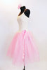 Soft pink nylon and tulle romantic ballet tutu dress has bodice with glitter cream lace and rose floral hair accessory. Side