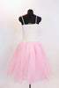 Soft pink nylon and tulle romantic ballet tutu dress has bodice with glitter cream lace and rose floral hair accessory. Back