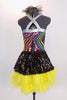 Rainbow swirled patterned leotard with yellow bottom and silver straps, has an attached skirt of ruffled, layered yellow tulle with a black sequined overlay. Back